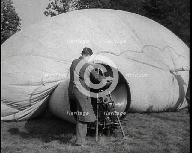 Men Inflating a Hot Air Balloon, 1936. Creator: British Pathe Ltd.