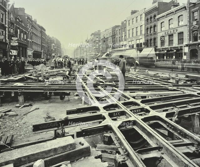 Men laying tramlines at a junction, Whitechapel High Street, London, 1929. Artist: Unknown.