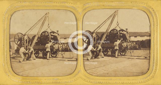 Men loading large iron wheels on platform, about 1865. Creator: Unknown.