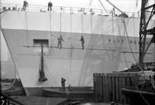 Men painting a vessel, Tilbury, Essex, c1945-c1965. Artist: SW Rawlings