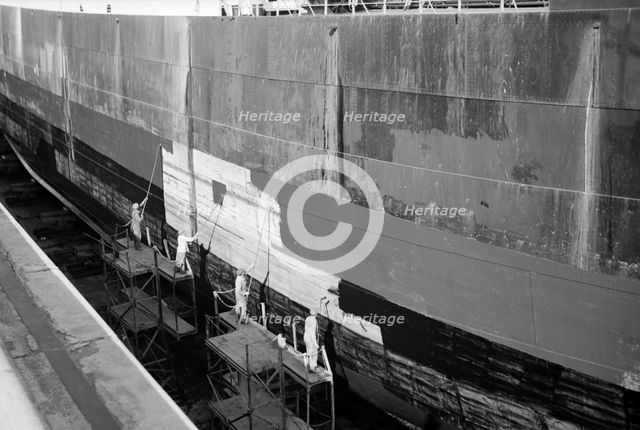 Men painting at Tilbury, Essex, c1945-c1965. Artist: SW Rawlings