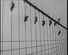 Men Painting the Brooklyn Bridge in New York City, 1922. Creator: British Pathe Ltd