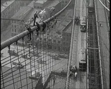 Men Painting the Brooklyn Bridge in New York City, 1922. Creator: British Pathe Ltd