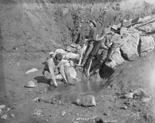 Men panning gold, between c1900 and 1927. Creator: Lomen Brothers