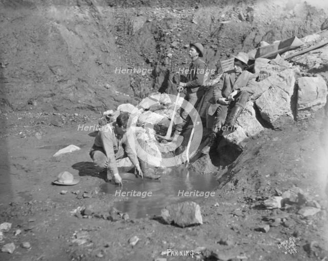 Men panning gold, between c1900 and 1927. Creator: Lomen Brothers.