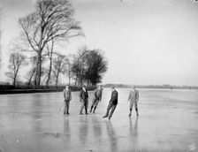 Men playing ice hockey on the frozen Medley Port Meadow, Oxford, Oxfordshire, c1860-c1922. Artist: Henry Taunt