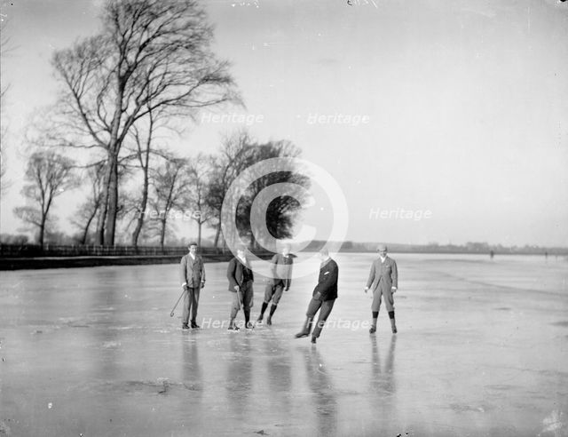 Men playing ice hockey on the frozen Medley Port Meadow, Oxford, Oxfordshire, c1860-c1922. Artist: Henry Taunt