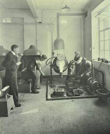Men pouring molten metal in a foundry, School of Engineering and Navigation, London, 1931