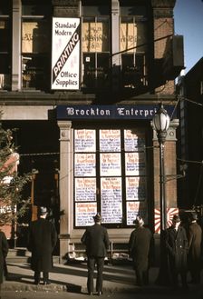 Men reading headlines posted in street-corner of Brockton Enterprise...office, Brockton, Mass., 1940 Creator: Jack Delano
