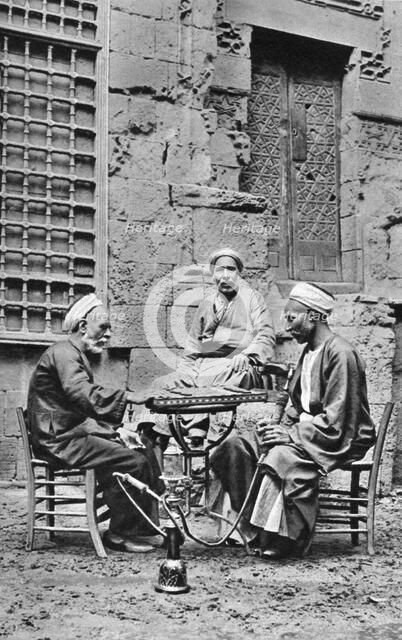 Men relaxing, Cairo, Egypt, c1922. Artist: Donald McLeish