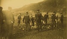 Men removing fish from seine, Baileys Harbor,1894 or 1895. Creator: Alfred Lee Broadbent