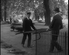 Men Removing Park Railings for Use in Factories, 1940. Creator: British Pathe Ltd