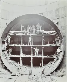 Men standing in the shield used to cut Rotherhithe Tunnel, Bermondsey, London, July 1907