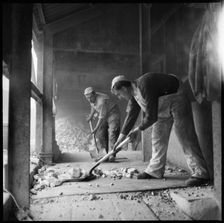 Men shovelling flint in a flint calcinating kiln, WJ Dolby works, Stoke-on-Trent, 1965-1968. Creator: Eileen Deste