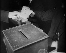 Men Sitting Around a Ballot Box, 1933. Creator: British Pathe Ltd