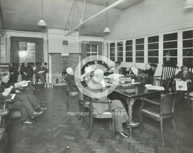 Men sitting in the library at Cedars Lodge old people's home, Wandsworth, London, 1939. Artist: Unknown.
