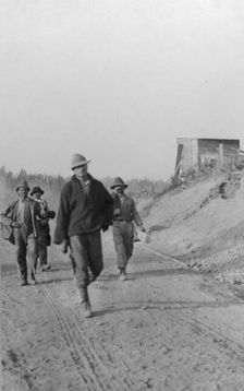 Men walking on dirt road, between c1900 and 1916. Creator: Unknown