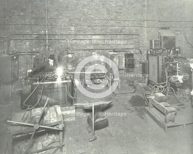 Men welding, Charlton Central Repair Depot, London, 1932. Artist: Unknown.