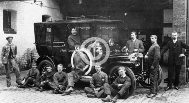 Men with a 1911 Daimler, c1911. Artist: Unknown