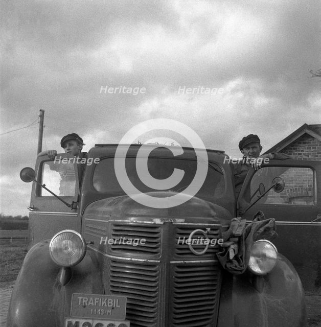 Men with a lorry at the sugar mill in Arlöv, Scania, Sweden, c1940s(?). Creator: Otto Ohm.