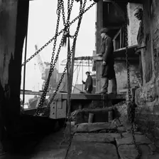 Men working at a wharf on the River Thames in Limehouse, London, c1945-c1965. Artist: SW Rawlings