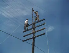 Men working on telephone lines, probably near a TVA dam hydroelectric plant, 1942. Creator: Alfred T Palmer