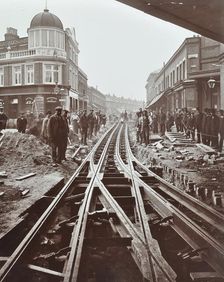 Men working on tramline electricification, Wandsworth, London, 1906