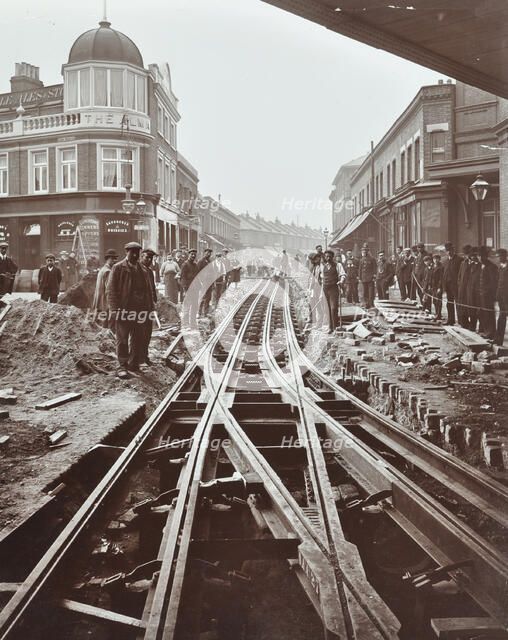 Men working on tramline electricification, Wandsworth, London, 1906. Artist: Unknown.
