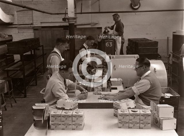 Men wrapping Rowntree's Fruit Gums and packing into boxes, Rowntree factory, York, Yorkshire, 1955. Artist: Unknown