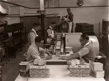 Men wrapping Rowntree's Fruit Gums and packing into boxes, Rowntree factory, York, Yorkshire, 1955