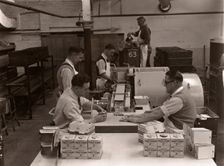 Men wrapping Rowntree's Fruit Gums and packing into boxes, Rowntree factory, York, Yorkshire, 1955