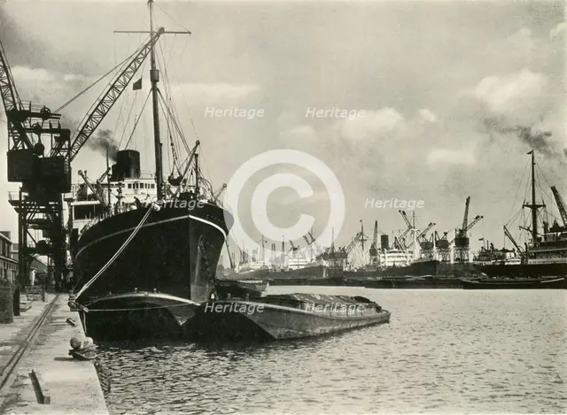 "Merchants Bring In Wares By Ships from Every Nation" Vessels alongside the Quays...', 1937. Creator: J Dixon-Scott.