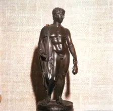 Mercury holding a purse, carrying a traveller's cloak. Roman brronze, 1st century