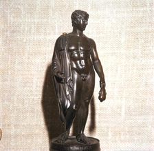 Mercury holding a purse, carrying a traveller's cloak. Roman brronze, 1st century