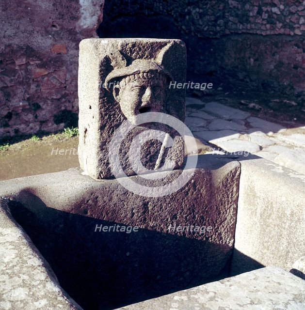 Mercury on a fountain in a street, Pompeii, Italy. Creator: Unknown.
