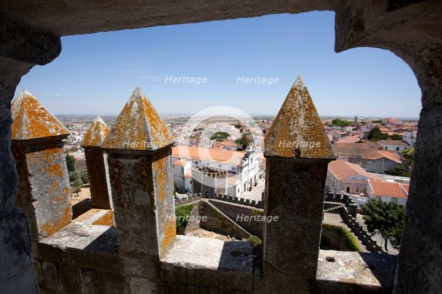 Merlons on the battlements of Beja Castle and view of the city, Beja, Portugal, 2009. Artist: Samuel Magal