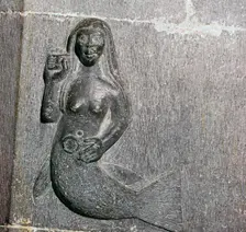 Mermaid on the chancel arch of Clonfert Cathedral, 12th century