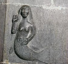 Mermaid on the chancel arch of Clonfert Cathedral, 12th century