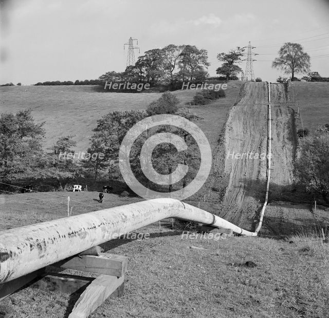 Mersey oil pipeline..., showing the pipeline after the welders have passed..., 24/09/1967. Creator: John Laing plc.