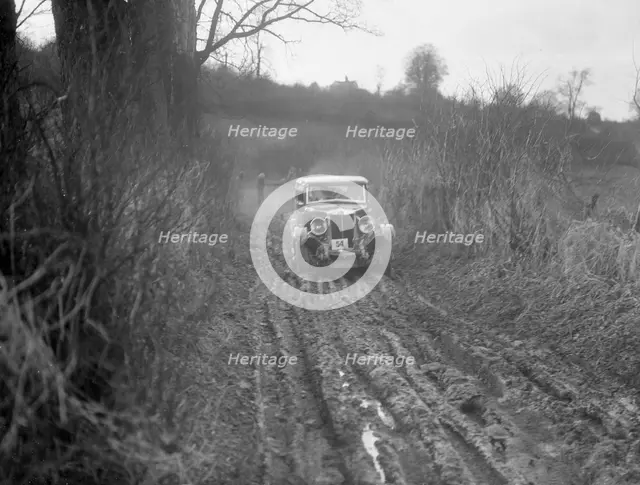 MG 18/80 of N Chichester-Smith competing in the MG Car Club Trial, Kimble Lane, Chilterns, 1931. Artist: Bill Brunell.