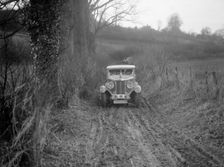 MG 18/80 saloon of R Gough competing in the MG Car Club Trial, Kimble Lane, Chilterns, 1931. Artist: Bill Brunell