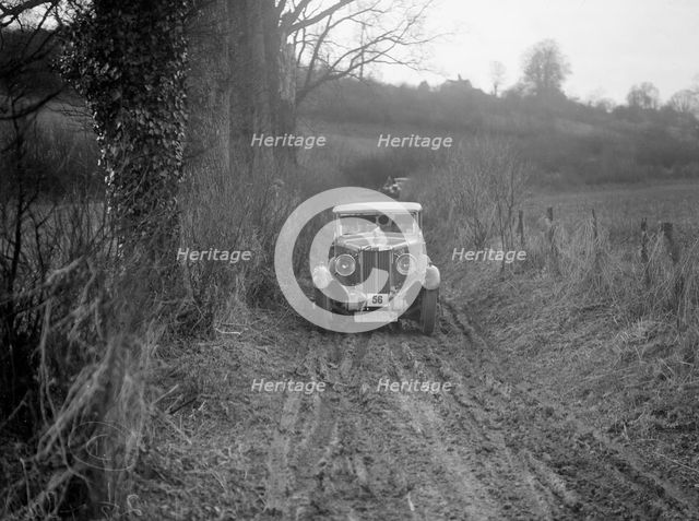 MG 18/80 saloon of R Gough competing in the MG Car Club Trial, Kimble Lane, Chilterns, 1931. Artist: Bill Brunell.