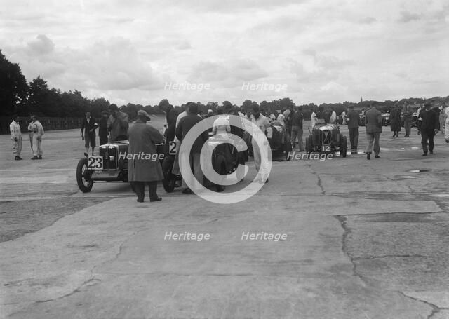 MG and Austin 7 at the LCC Relay GP, Brooklands, 25 July 1931. Artist: Bill Brunell.