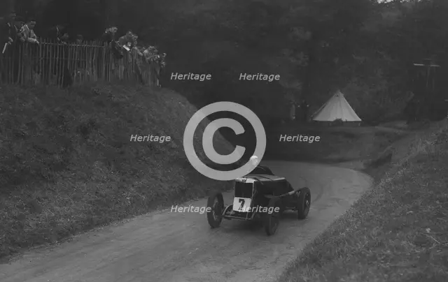 MG C type of Barbara Skinner competing in the Shelsley Walsh Hillclimb, Worcestershire, 1935. Artist: Bill Brunell.