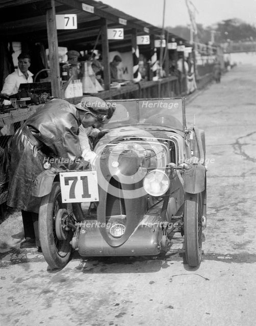 MG C type of Ron Horton and Bill Humphreys in the pits, JCC Double Twelve race, Brooklands, 1931. Artist: Bill Brunell.