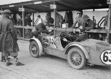 MG C type of TVG Selby and G Hendy in the pits at the JCC Double Twelve race, Brooklands, May 1931. Artist: Bill Brunell