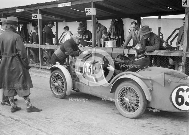MG C type of TVG Selby and G Hendy in the pits at the JCC Double Twelve race, Brooklands, May 1931. Artist: Bill Brunell.