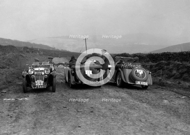 MG F type, Wolseley Hornet and MG Magnette at the Sunbac Inter-Club Team Trial, 1935. Artist: Bill Brunell.
