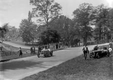 MG J2 passing the crashed Austin 7 of B Sparrow, Donington Park Race Meeting, Leicestershire, 1933. Artist: Bill Brunell