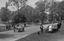 MG J2 passing the crashed Austin 7 of B Sparrow, Donington Park Race Meeting, Leicestershire, 1933. Artist: Bill Brunell
